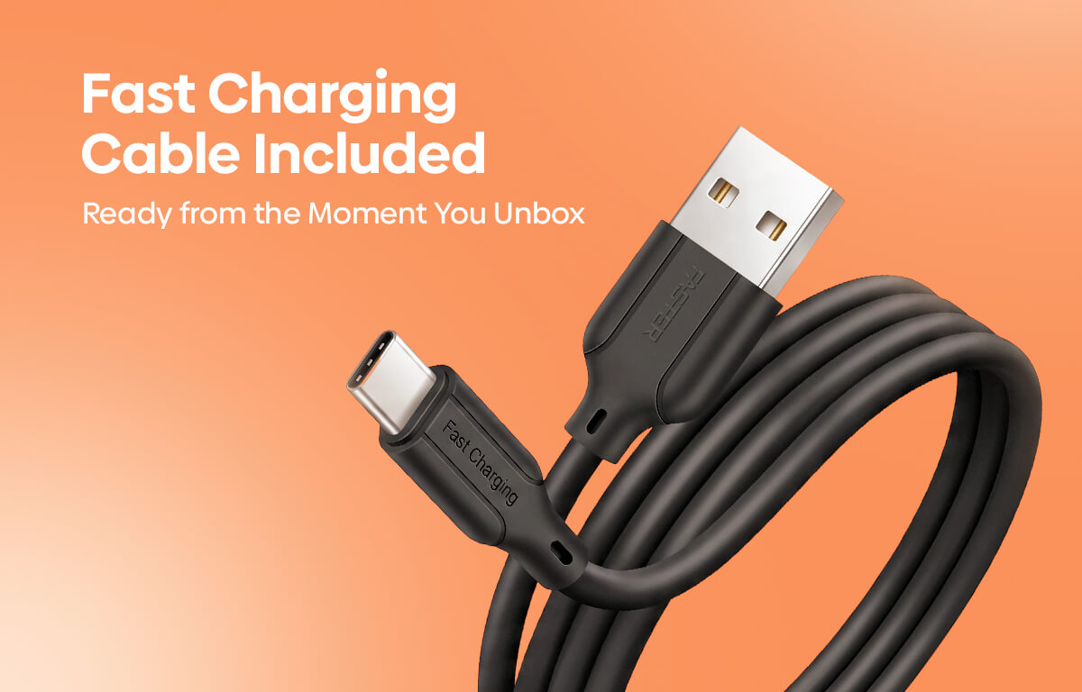 A coiled black USB-C to USB-A charging cable shown on a peach-orange gradient background with white text reading 'Fast Charging Cable Included' and 'Ready from the Moment You Unbox.'.