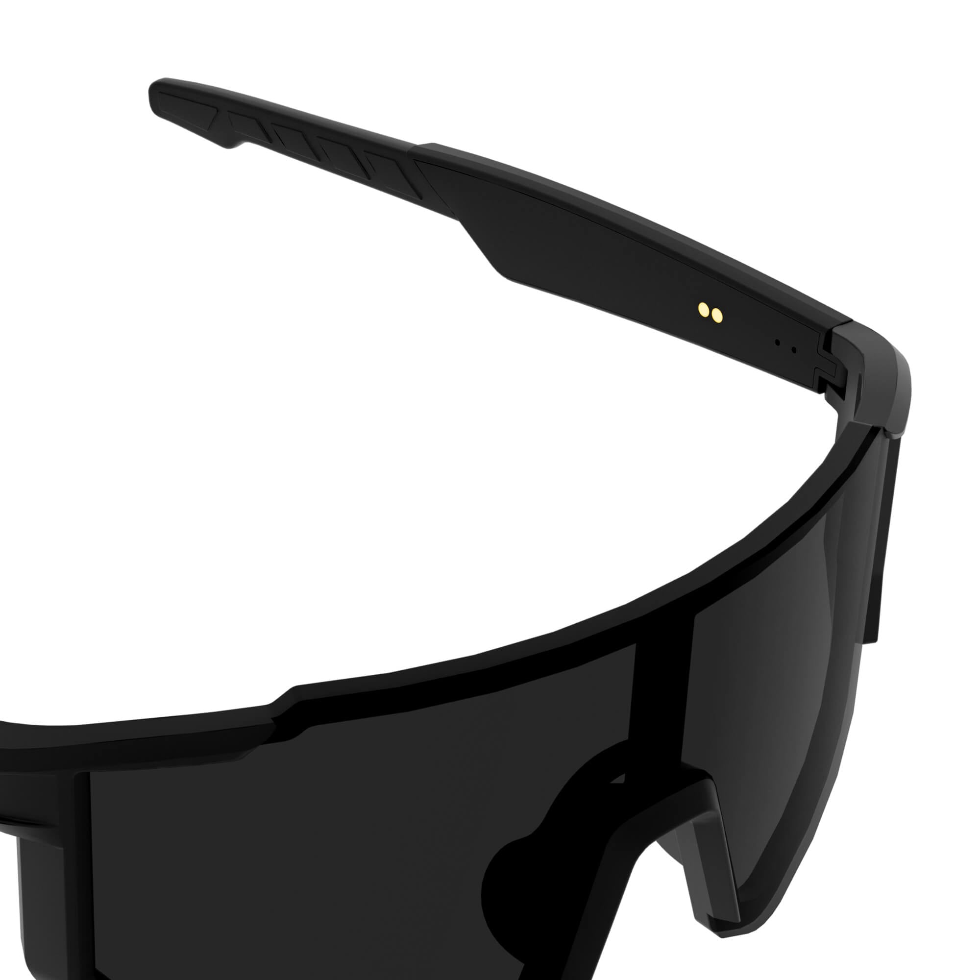 Close-up of a black wraparound shield-style smart glasses frame with dark lenses and small gold circular details on the inner temple, shown on a white background.
