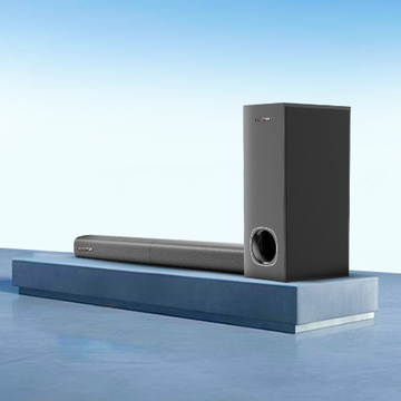 A modern multimedia speaker system with a soundbar and a subwoofer, both in black color, placed on a blue platform.