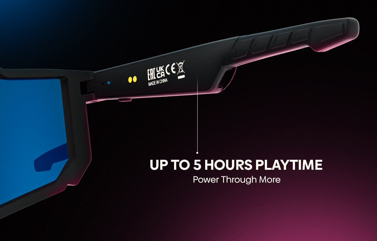 A close-up of a black gaming headset arm with a blue screen visible on the temple, featuring regulatory marks and text that reads 'UP TO 5 HOURS PLAYTIME Power Through More' on a dark gradient background.