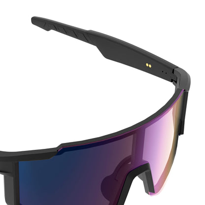 Close-up of a shield-style sports smart glasses frame with a matte black temple and a large mirrored lens shifting from blue to pink and orange, shown on a white background.