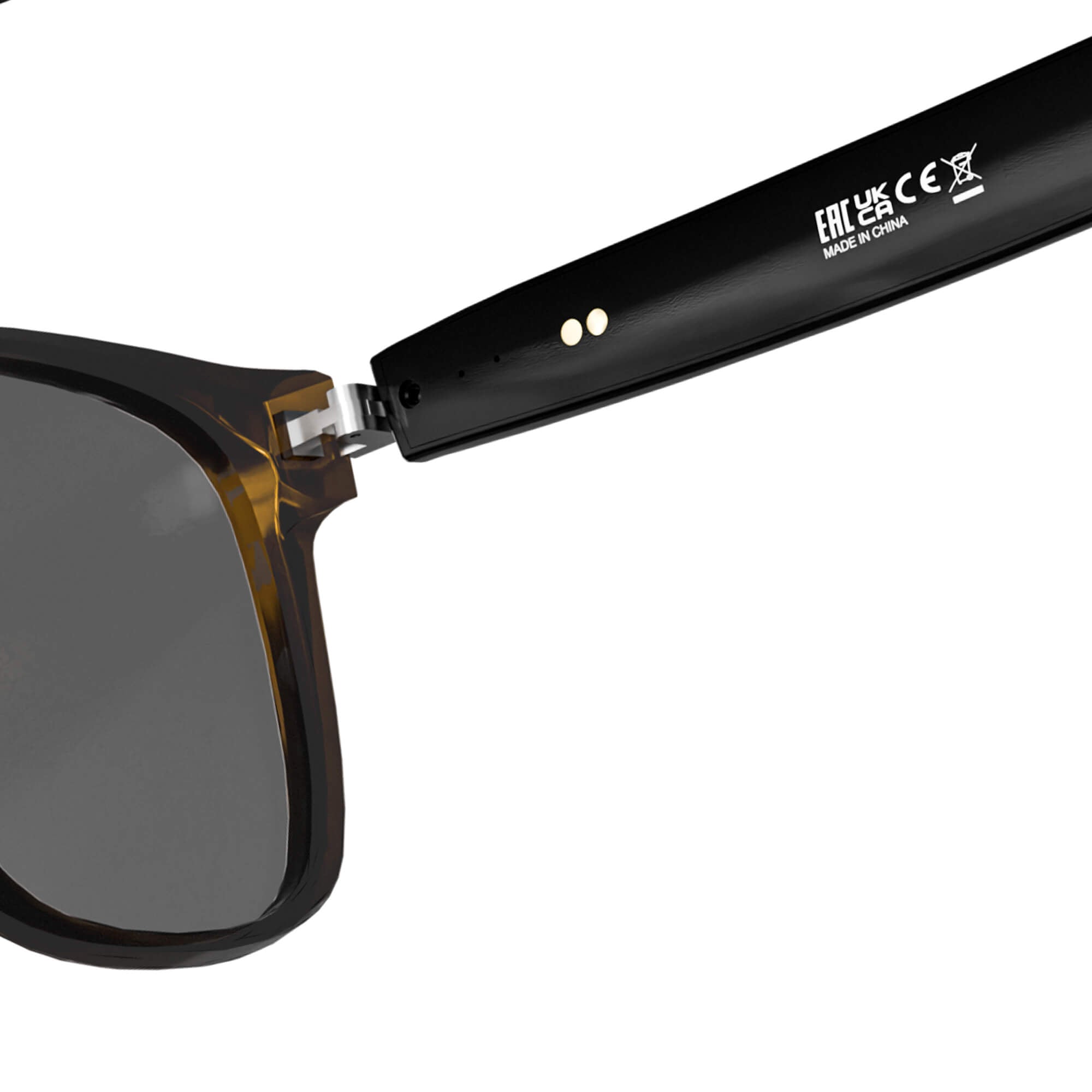 Close-up of a pair of sunglasses showing the temple arm and part of the dark lens, with white printed text on the black arm against a white background.