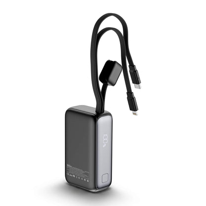 A black rectangular portable power bank with a coiled black cable attached, shown on a clean white background. The power bank has a dark gray front face, a silver side panel with a vertical power icon, and a small square button on the front.