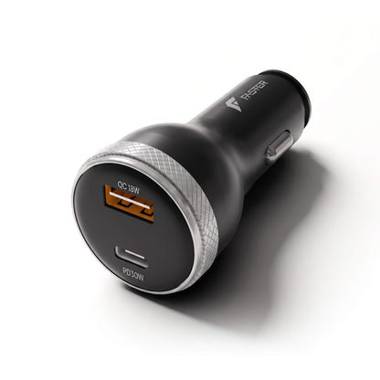 A black car charger with a silver textured ring, featuring a USB-C port with an orange accent and a USB-A port, on a white background.
