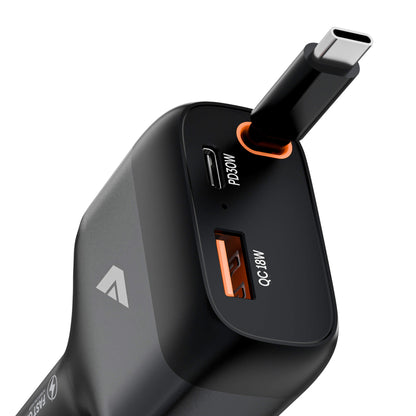 A close-up of a black multi-port car charger with USB-C and USB-A ports, featuring orange accent rings and white text indicating PD3.0W and M8/A 18W, on a white background.