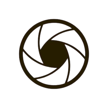 A line art camera lens icon on a solid white background.